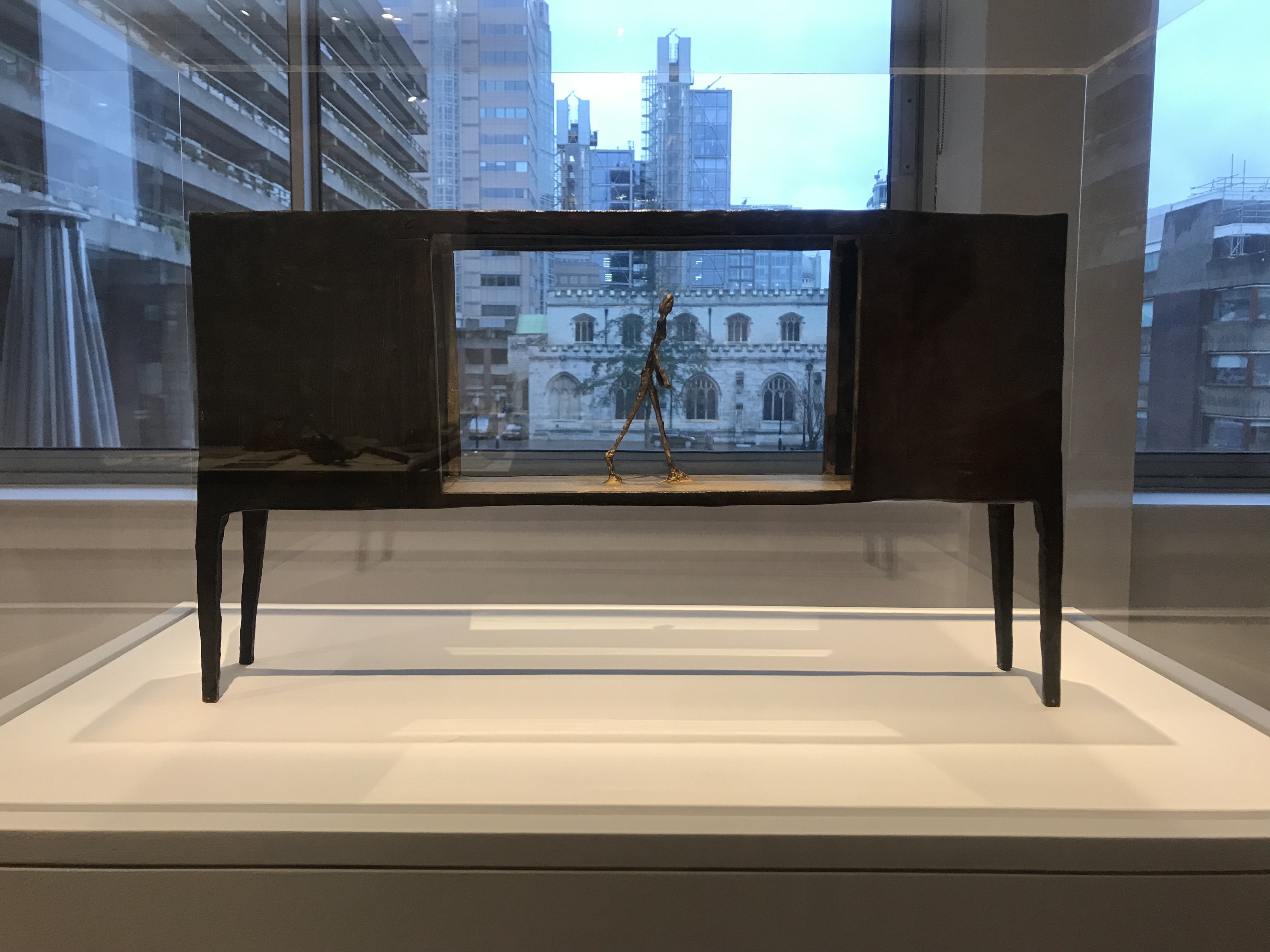 figurine between two houses