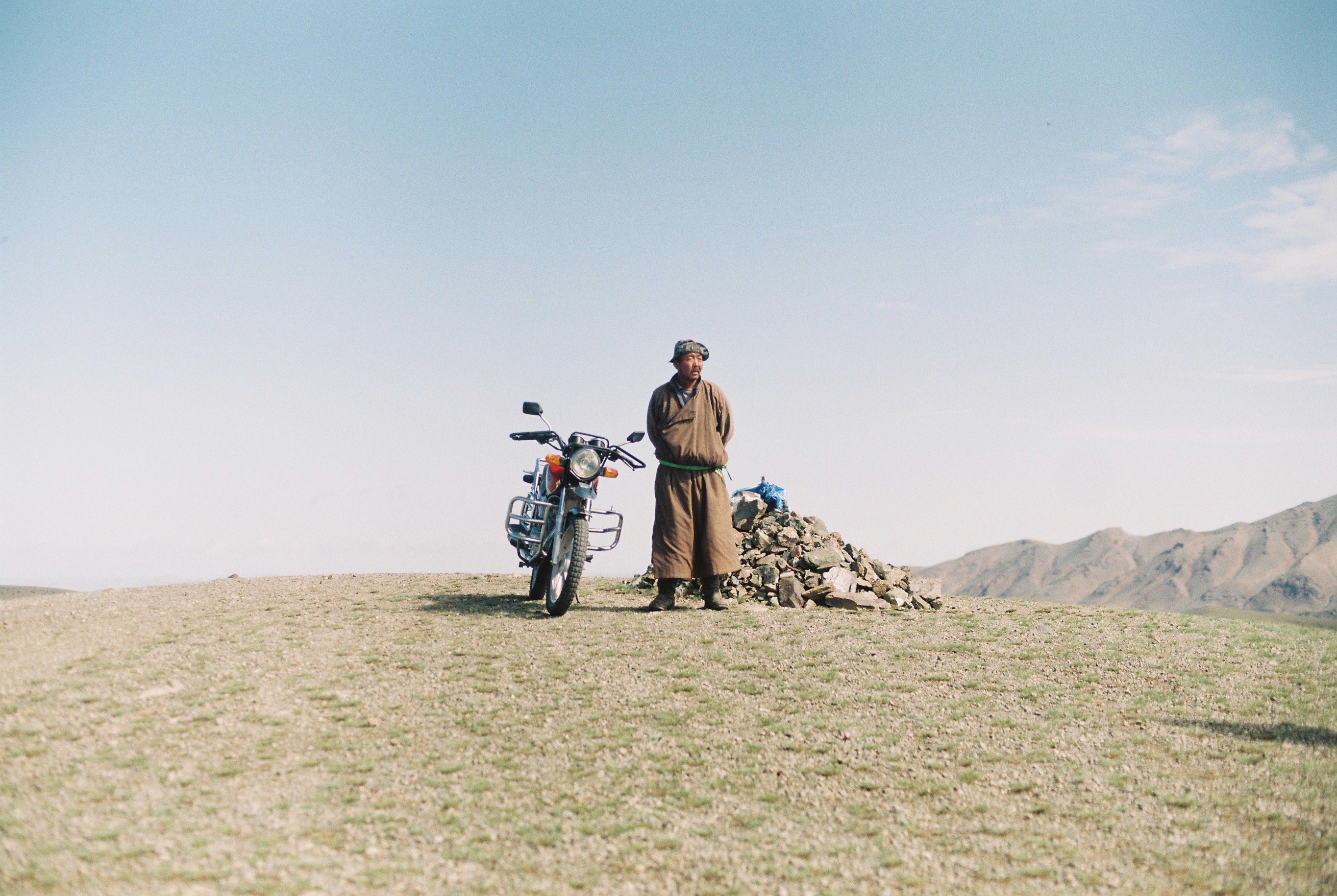 a bike, a man and stones
